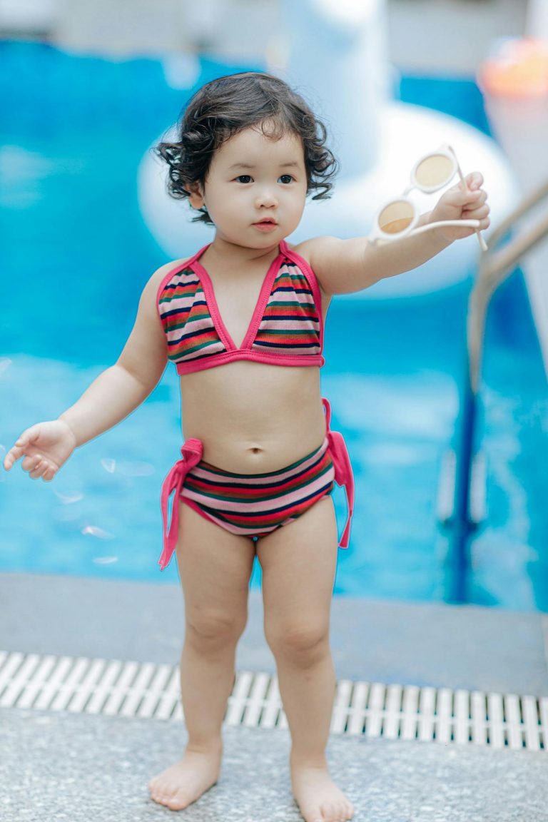Girl Standing in Bikini at Swimming Pool